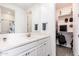 Bathroom with vanity, shelves and walk-in closet at 2922 W Amber Sun Dr, Phoenix, AZ 85085