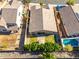 Aerial view showcasing the house's backyard, including a pool and covered patio at 2922 W Amber Sun Dr, Phoenix, AZ 85085