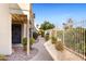 Pathway leading to condo entrance with iron fencing at 1425 E Desert Cove Ave # 49, Phoenix, AZ 85020
