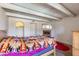 Bedroom with wooden bed frame, fireplace, and wood beams at 1425 E Desert Cove Ave # 49, Phoenix, AZ 85020