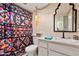 Clean bathroom with patterned shower curtain and modern vanity at 1425 E Desert Cove Ave # 49, Phoenix, AZ 85020
