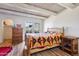 Bedroom with wooden bed frame, dresser, and patio access at 1425 E Desert Cove Ave # 49, Phoenix, AZ 85020