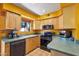 Kitchen boasts stainless steel appliances and wood cabinets at 1425 E Desert Cove Ave # 49, Phoenix, AZ 85020