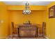 Small dining area with wooden bar and pendant lighting at 1425 E Desert Cove Ave # 49, Phoenix, AZ 85020
