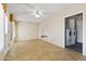 Laundry room with washer, dryer, and tiled flooring at 14201 N Crown Point Ct, Sun City, AZ 85351