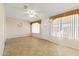 Sunroom with tile flooring and multiple windows at 14201 N Crown Point Ct, Sun City, AZ 85351