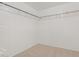 Large walk-in closet with built in shelving and hanging rods at 28614 N Sunset Dr, San Tan Valley, AZ 85143