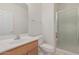 Clean bathroom with a shower, toilet, and vanity at 28614 N Sunset Dr, San Tan Valley, AZ 85143