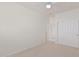 Bright bedroom with double doors to closet and adjacent bathroom at 28614 N Sunset Dr, San Tan Valley, AZ 85143