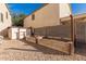 Landscaped backyard with shed and raised garden beds at 28614 N Sunset Dr, San Tan Valley, AZ 85143