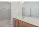 Clean bathroom with a shower/tub combo, vanity, and double doors at 28614 N Sunset Dr, San Tan Valley, AZ 85143