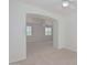 Bright bedroom with an arched entryway to an additional room at 28614 N Sunset Dr, San Tan Valley, AZ 85143