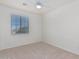 Well-lit bedroom featuring neutral walls and carpet flooring at 28614 N Sunset Dr, San Tan Valley, AZ 85143