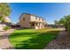 Large backyard with putting green, patio, and pool views at 28614 N Sunset Dr, San Tan Valley, AZ 85143