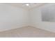Simple bedroom with light walls and carpeted floor at 28614 N Sunset Dr, San Tan Valley, AZ 85143