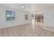 Open living room with view into kitchen and access to backyard at 28614 N Sunset Dr, San Tan Valley, AZ 85143