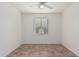 Bright bedroom with window and ceiling fan at 28614 N Sunset Dr, San Tan Valley, AZ 85143