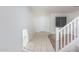 Tiled entryway with neutral-toned walls, a door and staircase at 28614 N Sunset Dr, San Tan Valley, AZ 85143