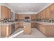 L-shaped kitchen with ample counter and cabinet space at 28614 N Sunset Dr, San Tan Valley, AZ 85143