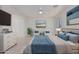 Main bedroom with a king-size bed and plenty of natural light at 28614 N Sunset Dr, San Tan Valley, AZ 85143