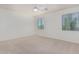 Spacious bedroom with neutral carpeting and large windows at 28614 N Sunset Dr, San Tan Valley, AZ 85143