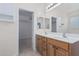Bathroom with double sinks, ample storage and a walk-in closet at 28614 N Sunset Dr, San Tan Valley, AZ 85143