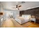 Main bedroom with fireplace, wood-look floors and accent wall at 2301 E Osborn Rd, Phoenix, AZ 85016