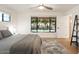 Bright bedroom with large window and comfortable bed at 2301 E Osborn Rd, Phoenix, AZ 85016