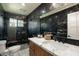 Elegant bathroom with marble finishes and walk-in shower at 2301 E Osborn Rd, Phoenix, AZ 85016