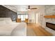 Main bedroom with wood-look floors, fireplace, and ceiling fan at 2301 E Osborn Rd, Phoenix, AZ 85016
