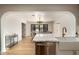 Open concept kitchen with marble island and farmhouse sink at 2301 E Osborn Rd, Phoenix, AZ 85016