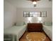 Guest bedroom with twin beds and ample closet space at 2301 E Osborn Rd, Phoenix, AZ 85016