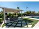 Private backyard oasis with pool, patio, and lush landscaping at 2301 E Osborn Rd, Phoenix, AZ 85016