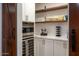 Modern kitchen pantry with white cabinets, marble counters, and stainless steel appliances at 2301 E Osborn Rd, Phoenix, AZ 85016