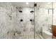 Spa-like shower with marble surround and dual shower heads at 2301 E Osborn Rd, Phoenix, AZ 85016