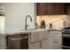 Modern kitchen with marble countertops and farmhouse sink at 2301 E Osborn Rd, Phoenix, AZ 85016