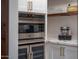Stainless steel appliances and marble countertops in this modern kitchen at 2301 E Osborn Rd, Phoenix, AZ 85016