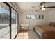 Bright bedroom with pool view, and sliding door access at 2301 E Osborn Rd, Phoenix, AZ 85016