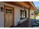 Inviting entryway with wood front door and brick facade at 2301 E Osborn Rd, Phoenix, AZ 85016