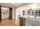 Open kitchen with pantry and island, hardwood floors at 2301 E Osborn Rd, Phoenix, AZ 85016