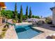 Enjoy this refreshing pool with a slide and a stylish umbrella at 3916 E Encanto St, Mesa, AZ 85205