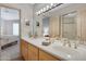 Bathroom with double sinks and a view into the bedroom at 16619 E Sullivan Dr, Fountain Hills, AZ 85268