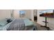 Main bedroom with ensuite bathroom access and large TV at 9333 E University Dr # 45, Mesa, AZ 85207