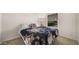 Bedroom with a double bed, and large window at 9333 E University Dr # 45, Mesa, AZ 85207