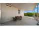 Covered patio with seating area adjacent to home at 9333 E University Dr # 45, Mesa, AZ 85207