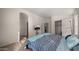 Bright bedroom with double bed, walk-in closet, and access to the bathroom at 9333 E University Dr # 45, Mesa, AZ 85207