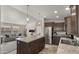 Open kitchen with island, stainless steel appliances, and living room view at 9333 E University Dr # 45, Mesa, AZ 85207