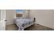 Small bedroom with a double bed and window at 9333 E University Dr # 45, Mesa, AZ 85207