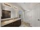 Bathroom with double vanity, shower/tub combo, and large mirror at 9333 E University Dr # 45, Mesa, AZ 85207