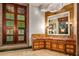 Bathroom with custom cabinetry and large mirror at 8100 N 68Th St, Paradise Valley, AZ 85253
